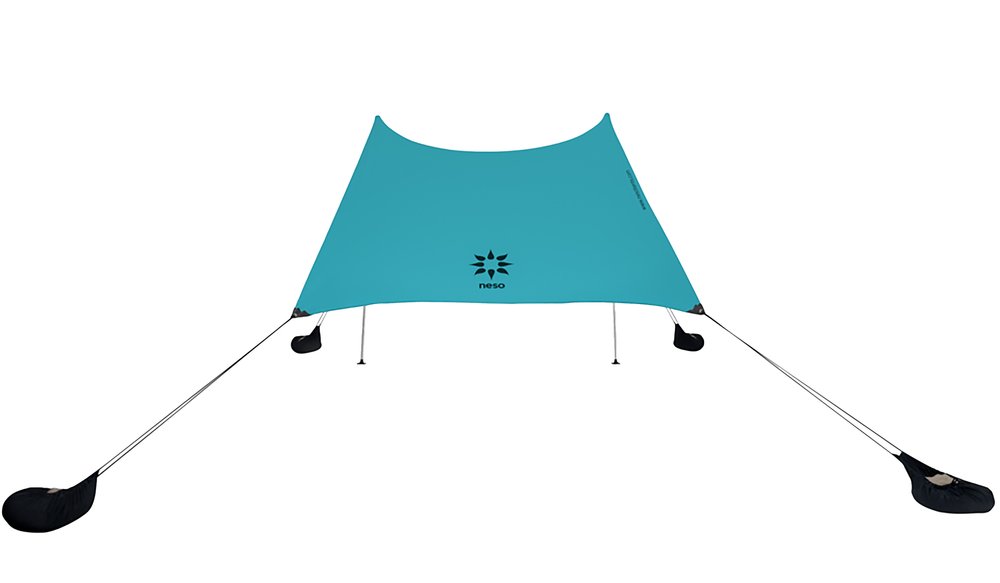 Neso Portable 7x7 beach tent with sand-anchor corner pockets shading a family