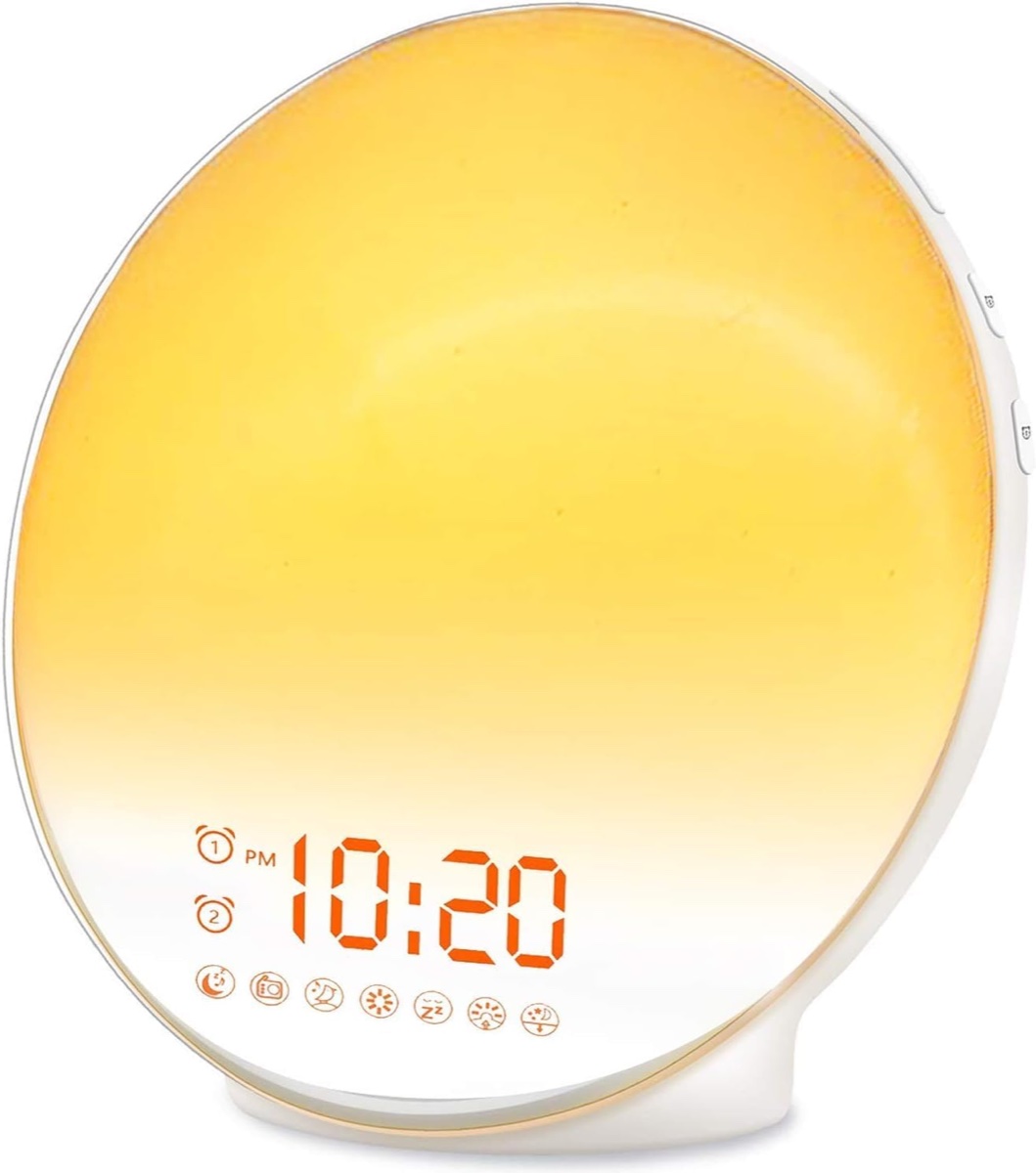 JALL Wake Up Light sunrise alarm clock with round white face showing time and colored ambient light ring