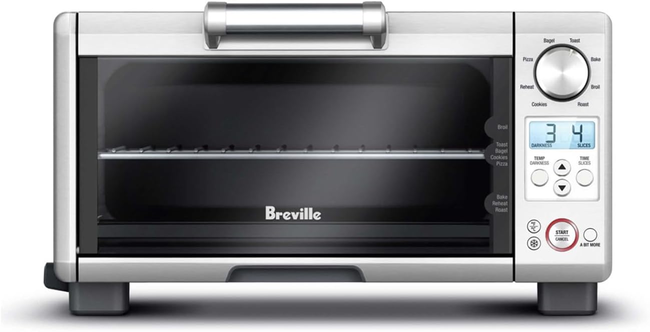 Breville BOV450XL Mini Smart Oven, a compact brushed stainless steel countertop toaster oven with LCD display