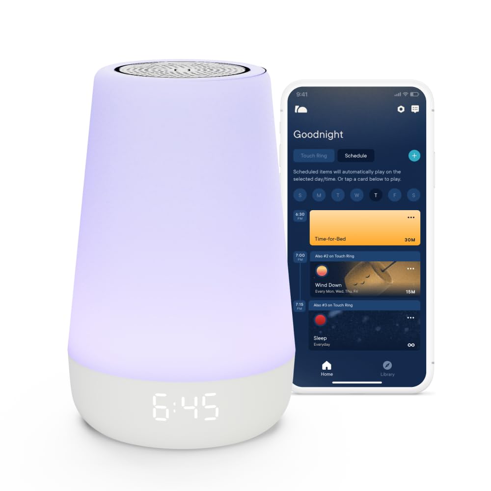 Hatch Rest 2nd Gen baby sound machine and night light, a soft rounded device glowing with a warm light