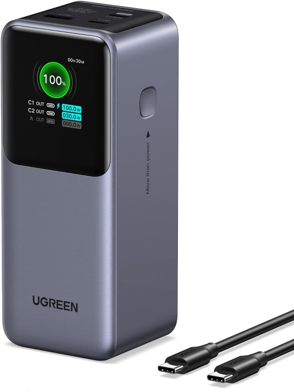 Grey UGREEN Nexode power bank with a color screen showing its charge level and the output of each port, next to a black USB-C cable