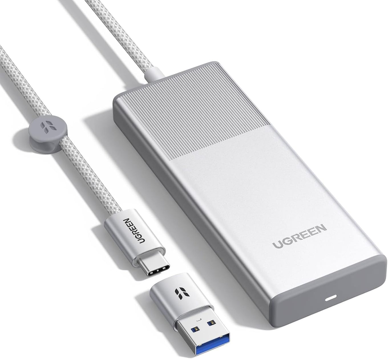 Silver UGREEN 95846FX enclosure with a ribbed aluminum top and the UGREEN logo, its built-in braided cable ending in a USB-C plug