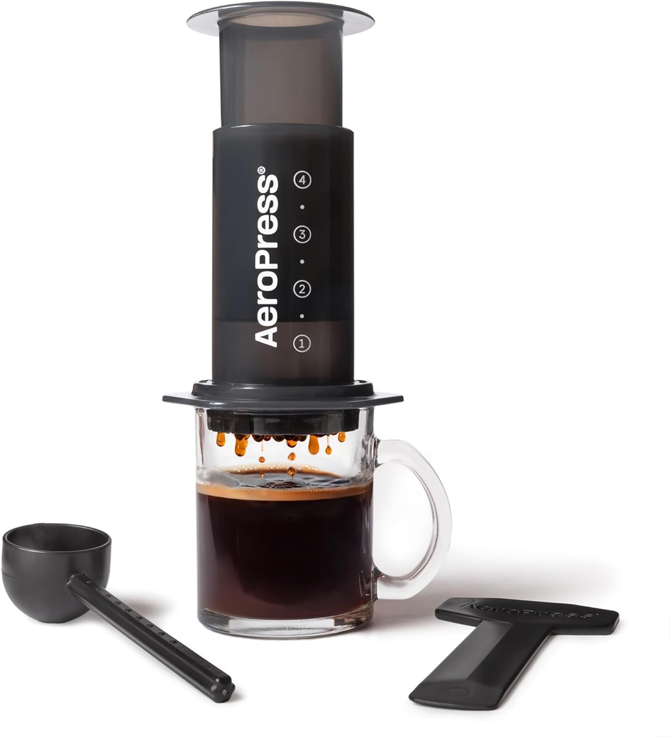 AeroPress Original Coffee Press translucent plastic plunger and chamber with red filter cap and black scoop
