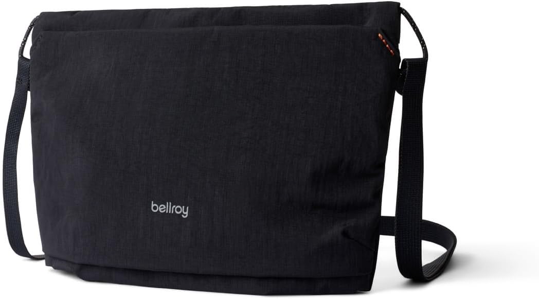 Bellroy Lite Sacoche ultra-slim crossbody bag in black water-resistant ripstop with a charcoal adjustable webbing strap, on a white background