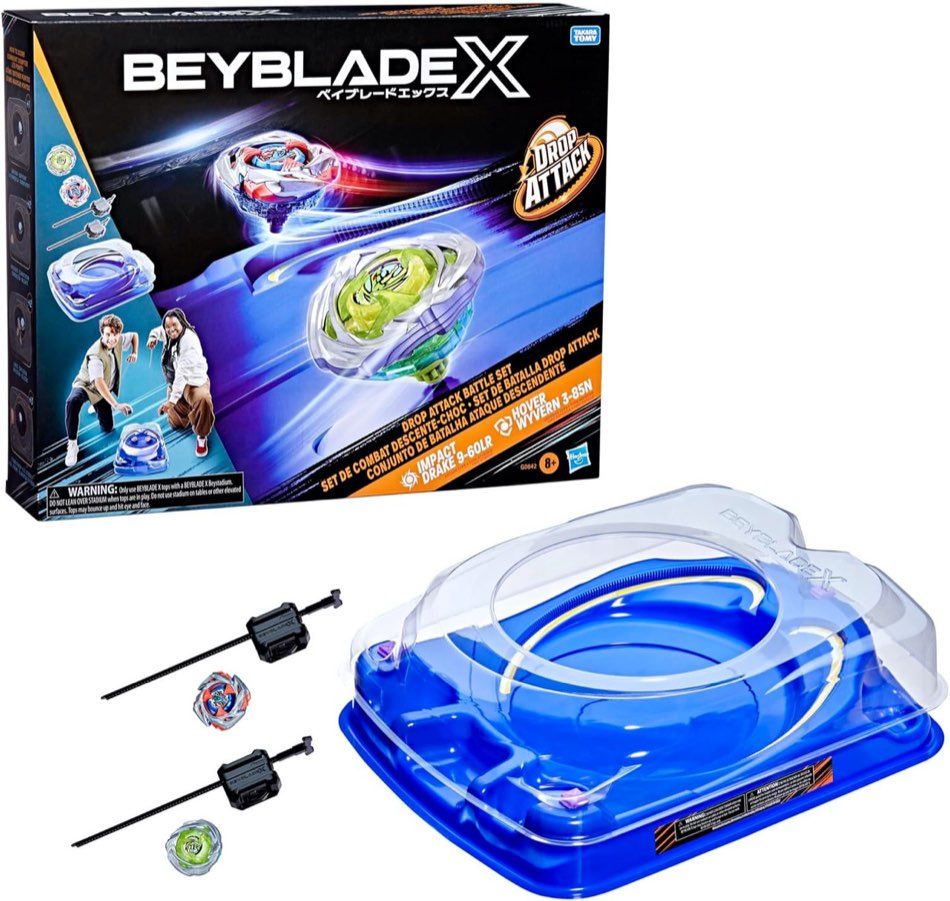 Beyblade X Drop Attack Battle Set box with blue clear-dome Beystadium, two spinning tops, and two black ripcord launchers
