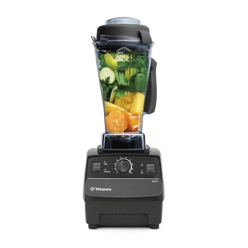 Vitamix 5200 professional-grade countertop blender in black with 64 oz container and tamper creating a smooth vortex blend